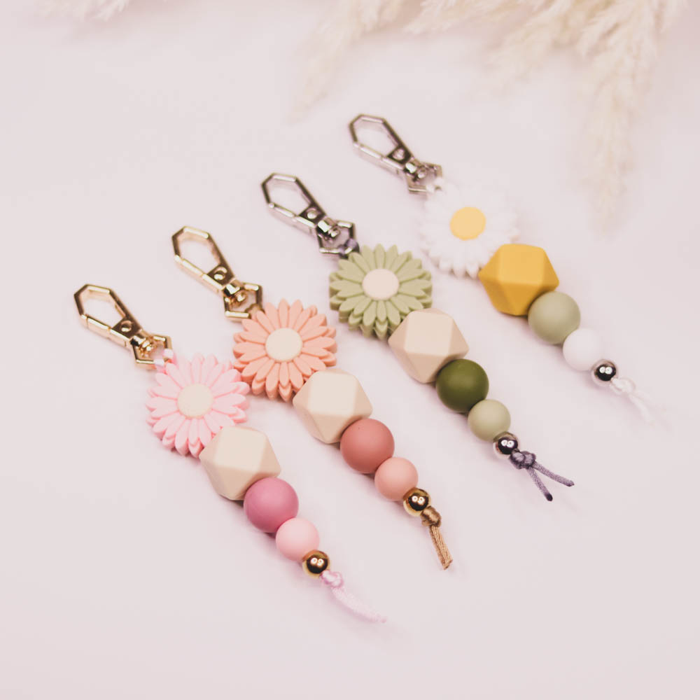 Silicone Bead Keychain - Daisy Pink Perfect as a thoughtful gift or a stylish accessory for yourself, these keychains offer a touch of personality and charm to your everyday essentials
