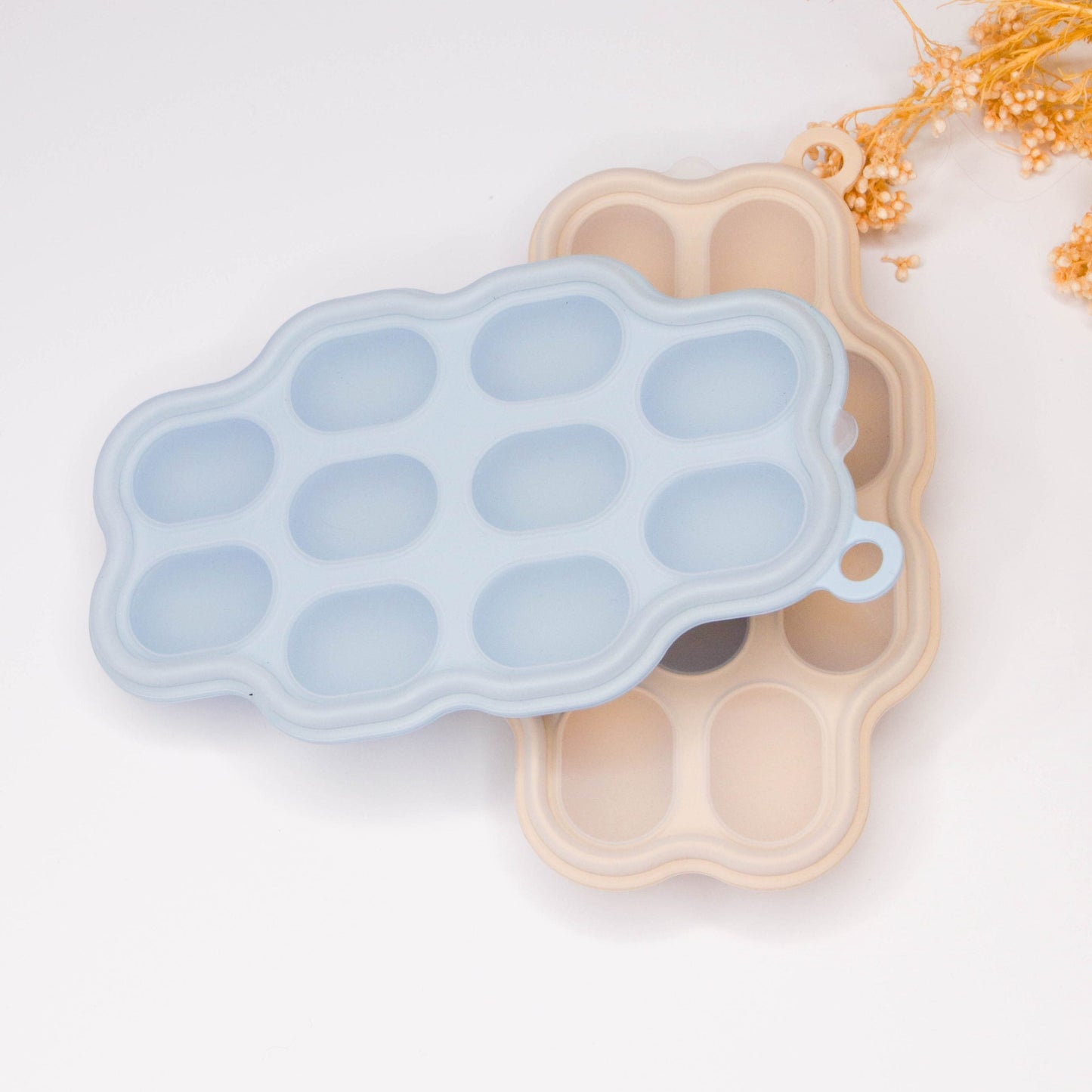 silicone feeder frozen food tray Silicone Frozen Food Tray - 10 Compartments Preparing food for you little ones made easy with our silicone food trays. These 10 compartment moulds make the perfect portion. Simply fill the moulds and pop it in the freezer of fridge. Sizing pairs perfectly with our silicone feeders. Made from food grade silicone, easy to clean and dishwasher safe. You can use for food storage or as a nipple tray for your little ones to explore new foods. Perfect for purees or water.