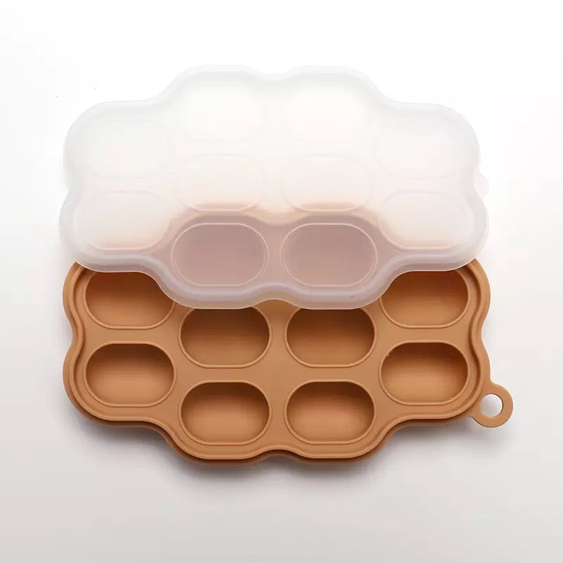 Silicone Frozen Food Tray - 10 Compartments Preparing food for you little ones made easy with our silicone food trays. These 10 compartment moulds make the perfect portion. Simply fill the moulds and pop it in the freezer of fridge. Sizing pairs perfectly with our silicone feeders. Made from food grade silicone, easy to clean and dishwasher safe. You can use for food storage or as a nipple tray for your little ones to explore new foods. Perfect for purees or water.
