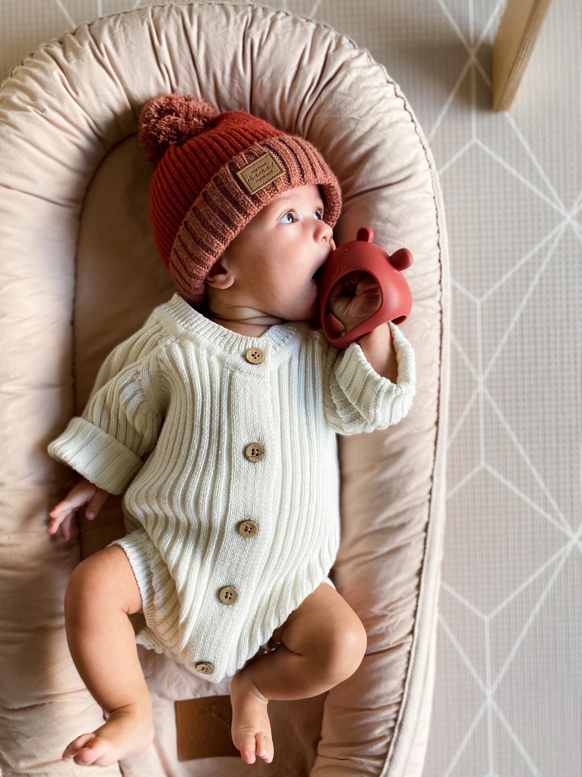 Teething Mitten Glove Silicone Bear - Teether Mitt Baby constantly chewing on hands, can't quite grasp objects just yet? These teething mitten gloves are perfect as a first Teether. Made from all silicone, they are lightweight, easy to keep clean and perfect to soothe those gums. Slip over baby's hand for them to grasp the internal bar and watch baby self soothe those teething woes.  The Little bear ears and arms are textured on the back giving that extra soothing effect.