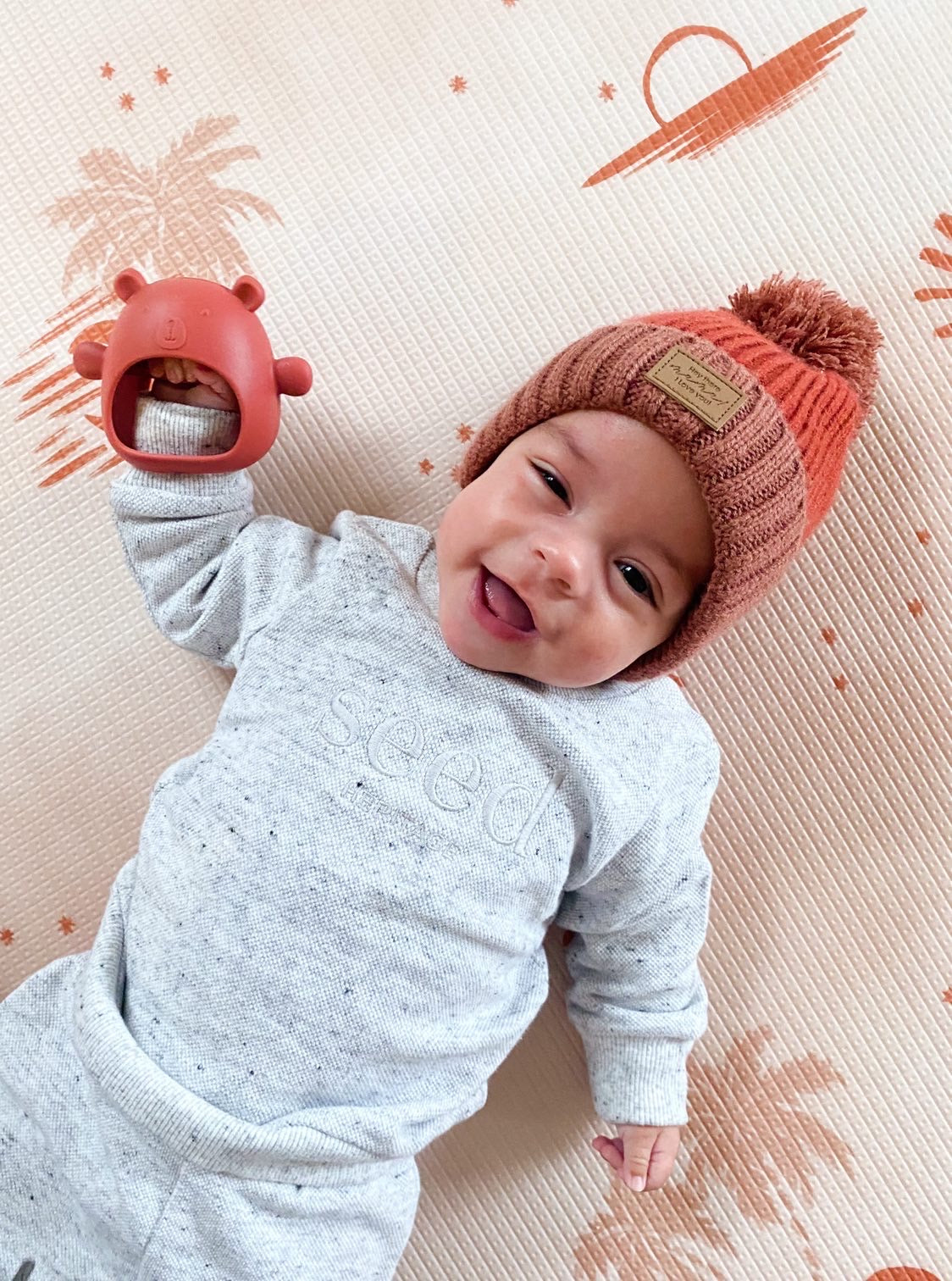 Teething Mitten Glove Silicone Bear - Teether Mitt Baby constantly chewing on hands, can't quite grasp objects just yet? These teething mitten gloves are perfect as a first Teether. Made from all silicone, they are lightweight, easy to keep clean and perfect to soothe those gums. Slip over baby's hand for them to grasp the internal bar and watch baby self soothe those teething woes.  The Little bear ears and arms are textured on the back giving that extra soothing effect.