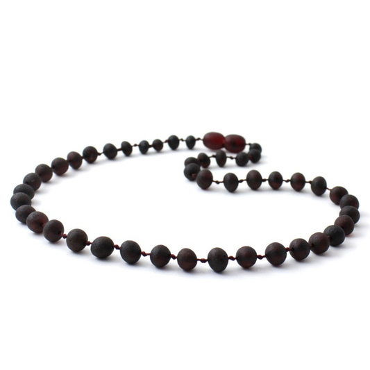 Amber Necklace Cherry Raw | 32cm Our Amber necklaces imported directly from Lithuania, the home of Baltic Amber and the Baltic Sea, where they are beautiful handmade. Baltic Amber necklaces help with teething symptoms as well as looking great. Amber beads are a great natural solution to assist your child through the misery of teething! These are not designed to be chewed or mouthed in any way.