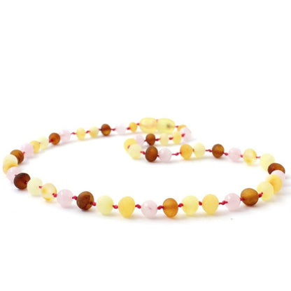 Amber Necklace Multi amber raw and Rose Quartz Baby 32cm Our Amber necklaces imported directly from Lithuania, the home of Baltic Amber and the Baltic Sea, where they are beautiful handmade. Baltic Amber necklaces help with teething symptoms as well as looking great.