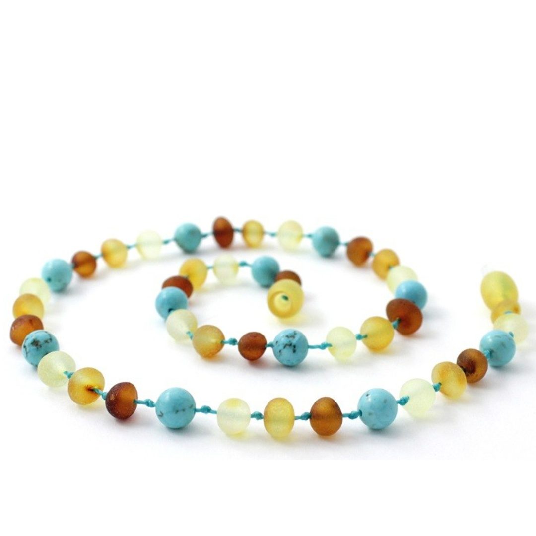 Amber Necklace Multi amber raw and Turquoise Baby 32cm Our Amber necklaces imported directly from Lithuania, the home of Baltic Amber and the Baltic Sea, where they are beautiful handmade. Baltic Amber necklaces help with teething symptoms as well as looking great.