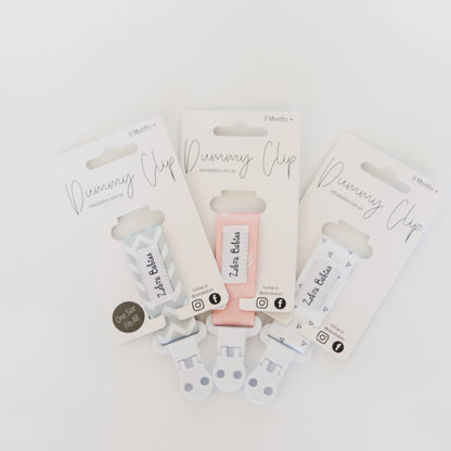 Dummy Clip - Flexi Ribbon dummy clip Our flexi ribbon dummy clips are a stylish, modern and come in a great range of colours. Practical and easy to attach to baby’s dummy. Suitable for most brands of soothers. Our clips are a soft but