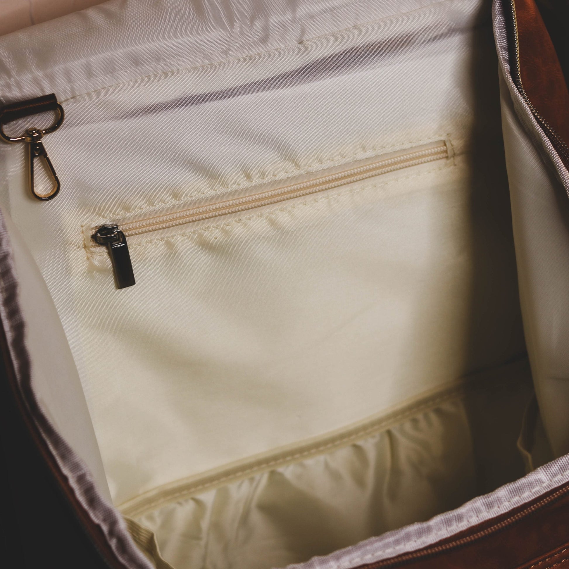 Faux Leather Nappy Bag Backpack - Luxe Tan Brown Our Faux Brown Leather Nappy Bag adds a sophisticated look to an everyday essential, stylish, functionality for everyday use. Nappy bag backpacks are an essential part of the babies haul when leaving the house – A Must have! An Amazing quality, so soft to touch, multi functional backpack, perfect for busy parents.