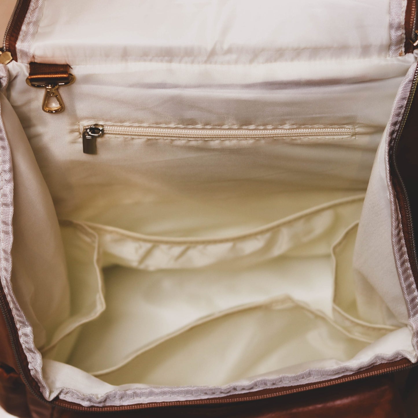 Faux Leather Nappy Bag Backpack - Luxe Tan Brown Our Faux Brown Leather Nappy Bag adds a sophisticated look to an everyday essential, stylish, functionality for everyday use. Nappy bag backpacks are an essential part of the babies haul when leaving the house – A Must have! An Amazing quality, so soft to touch, multi functional backpack, perfect for busy parents.