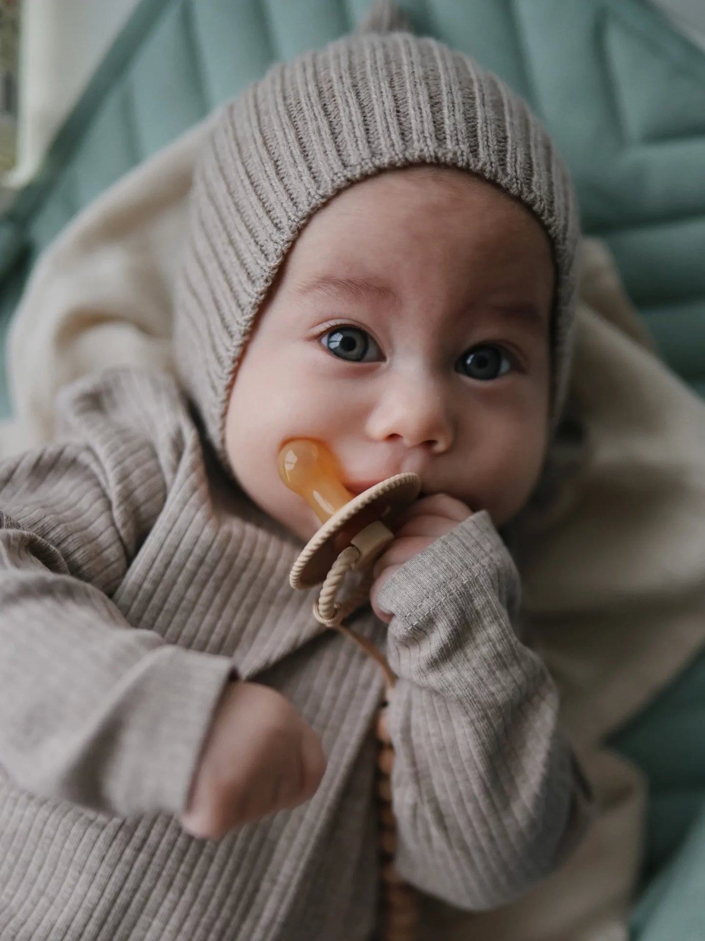 FRIGG DUMMIES The FRIGG dummies line of silicone pacifiers has been thoughtfully designed for your baby's comfort. The outward curve keeps the dummy