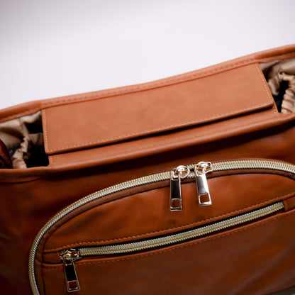 Pram Caddy Pram Caddy Organiser Faux Leather - Tan Pram caddy organisers keep everything you need close at hand, whilst keeping you hands-free. Our Pram Caddy is made from high quality faux leather