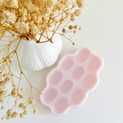 Silicone Frozen Food Tray - 10 Compartments Preparing food for you little ones made easy with our silicone food trays. These 10 compartment moulds make the perfect portion. Simply fill the moulds and pop it in the freezer of fridge. Sizing pairs perfectly with our silicone feeders. Made from food grade silicone, easy to clean and dishwasher safe. You can use for food storage or as a nipple tray for your little ones to explore new foods. Perfect for purees or water. 