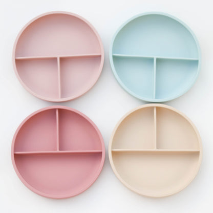 Silicone suction plate with divider Silicone plates are a great addition to babies tableware collection. Large strong silicone suction base with easy lift tab to help keep it suck to the table surface, helping keep the flat from being knocked or thrown on the floor.Pair it with one of our silicone bibs for easy clean up! Our silicone products are made from high quality food grade silicone, containing no nasty chemicals, BPA and phthalate free.