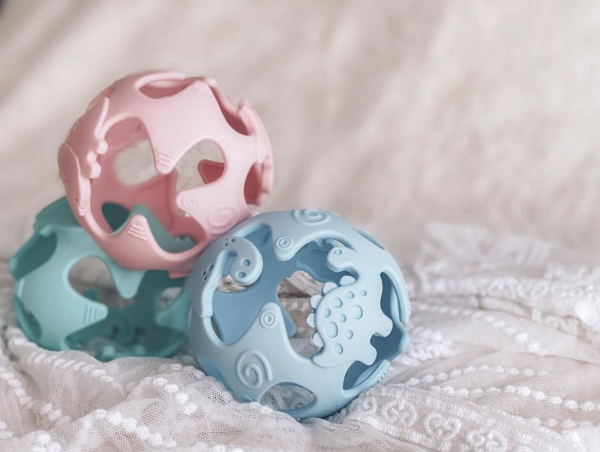 Silicone Dinosaur Sensory Teething Ball Our dinosaur teething balls are great for little hands to grasp, stimulating sensory play time, textured flexible toy to help soothe baby's gum.
