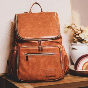 Faux Leather Nappy Bag Backpack - Luxe Tan Brown Our Faux Leather Nappy Bag adds a sophisticated look to an everyday essential, stylish, functionality for everyday use. Nappy bag backpacks are an essential part of the babies haul when leaving the house – A Must have! An Amazing quality, so soft to touch, multi functional backpack, perfect for busy parents.