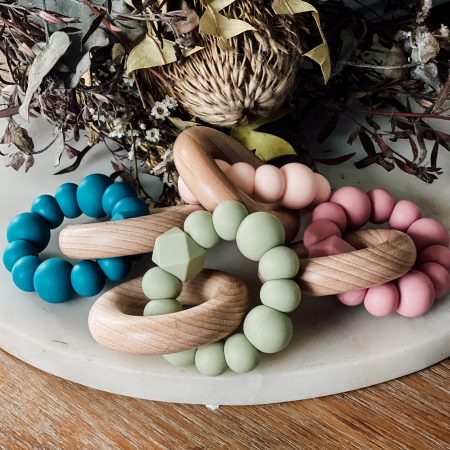 Silicone and Beechwood Teething Ring - Classic Teether Toy Silicone and Beech Wood Teething Ring - Silicone and beech wood teethers are the best of both worlds when it comes to soothing your little ones teething woes. Soft BPA free, food grade silicone will help soothe sore gums while natural beech wood will provide relief as well as assisting with teeth to emerge. Safe and practical teething toy. Ready made, ready to ship.