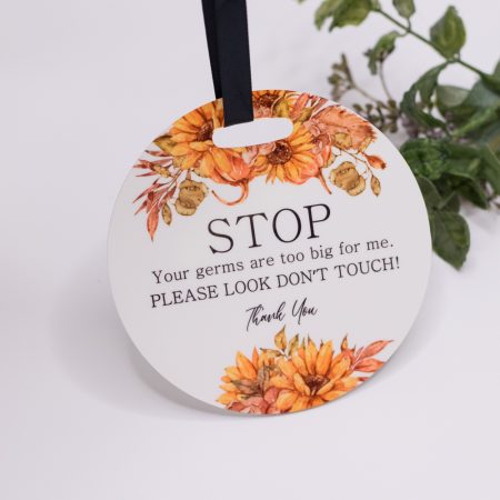 Pram Plaque, STOP your germs are too big for me - Sunflowers Keep your baby safer with there Stop your germs are too big for me signs. Our pram plaques & birth announcement discs are handmade by us and our materials are all sourced within Australia. Made from quality 10cm round and 3mm thick Acrylic. We have added a gorgeous matte ribbon, making it easy to tie onto your pram.  We digitally designed each disc and our designs are exclusive to us. Quality Australian handmade Sourcing and supporting other small businesses in Australia Our prints will not rub off peel or transfer. This Product is not a toy and should be kept out of reach of children as well as the ribbon that is attached.