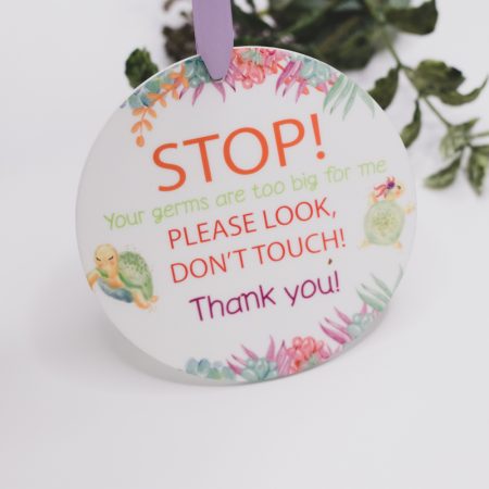 Pram Plaque, STOP your germs are too big for me - Flowers Keep your baby safer with there Stop your germs are too big for me signs. Our pram plaques & birth announcement discs are handmade by us and our materials are all sourced within Australia. Made from quality 10cm round and 3mm thick Acrylic. We have added a gorgeous matte ribbon, making it easy to tie onto your pram.  We digitally designed each disc and our designs are exclusive to us. Quality Australian handmade Sourcing and supporting other small businesses in Australia Our prints will not rub off peel or transfer. This Product is not a toy and should be kept out of reach of children as well as the ribbon that is attached.