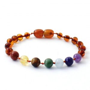 Amber Bracelet Multi Chakra | Baby 14cm Our Amber bracelets imported directly from Lithuania, the home of Baltic Amber and the Baltic Sea, where they are beautiful handmade. Baltic Amber bracelets help with teething symptoms as well as looking great on baby. Amber beads are a great natural solution to assist your child through the misery of teething! These are not designed to be