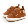 Riley Velcro Baby Shoes - Brown Introducing our charming brown pu leather baby shoes with velcro straps